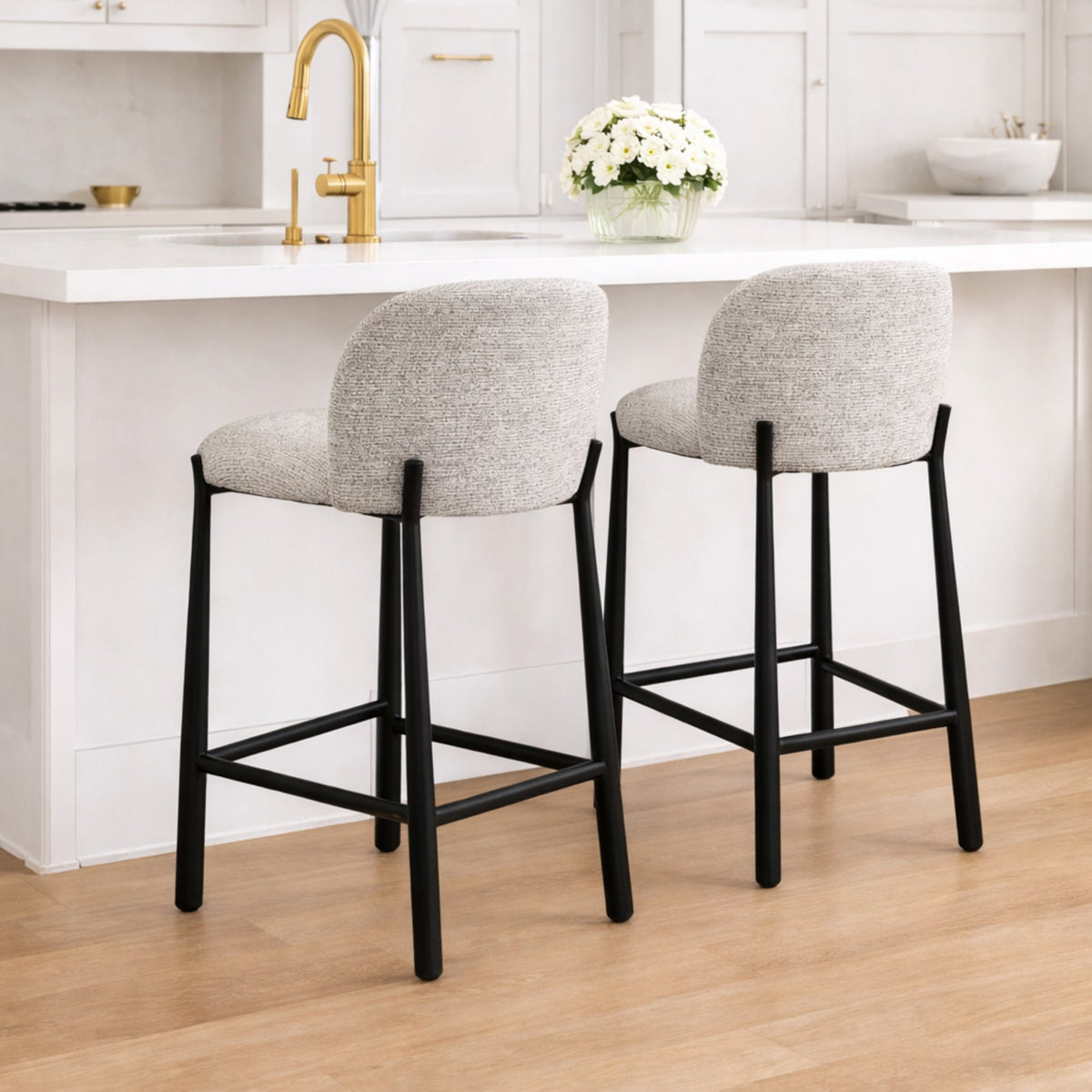 Pair of Ava counter height chairs in light grey fabric at contemporary kitchen island, modern home seating