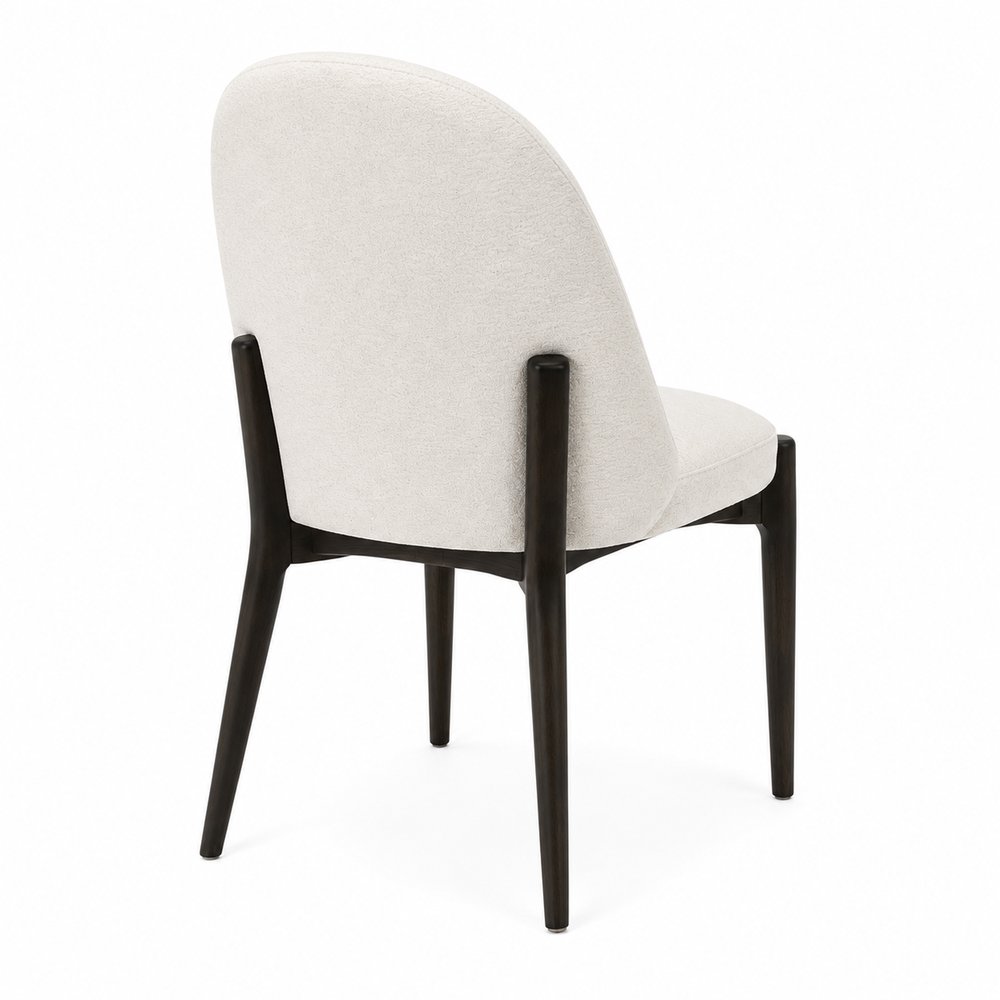 Rear three-quarter view of the Liam dining chair in Ivory performance fabric with dark walnut wood frame on a white background.