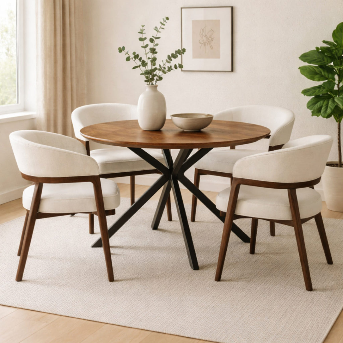 Ivanna round dining table in walnut with black metal base styled with four upholstered dining chairs in a modern dining room