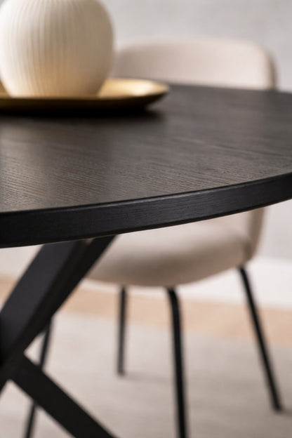 Olen round dining table black wood top close-up showing smooth beveled edge and matte finish